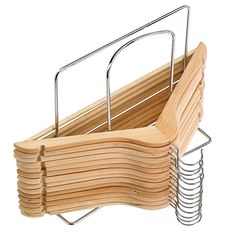 a stack of wooden utensils in a metal holder