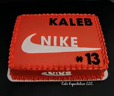 a cake with the number 13 on it is decorated in red and white icing