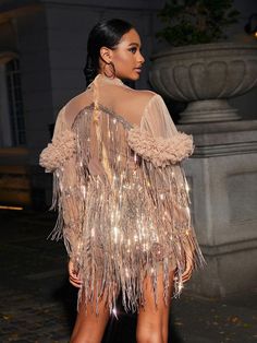 Turn heads in this glamorous Sparrow Sequin Fringe Mini Dress In Champagne. Featuring shimmering sequin fabric and eye-catching fringe details. this mini length dress is perfect for evening occasions. It is adorned with a sheer mesh long sleeve to create a stylish silhouette. Material: 100% Polyester Invisible zipper opening at the back Stretch Factor: Non Stretch Clean: Dry clean only Color may vary due to the lighting on images. The product images (without model) are the closest to the true co Fringe Mini Dress, Jumpsuits And Romper, Feather Dress, Maxi Dress Green, Mesh Long Sleeve, Sequin Fabric, Embellished Dress, Prom Party Dresses, Shop Maxi Dresses