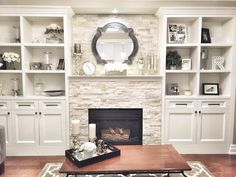 a living room filled with furniture and a fire place