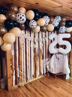 balloons and streamers decorate the entrance to a 50th birthday party