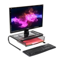 a computer monitor sitting on top of a desk with a keyboard and mouse next to it