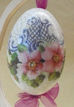 an egg with flowers painted on it