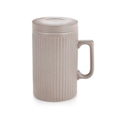 a white coffee mug with a lid and handle on a white background, it is made out of ceramic