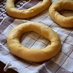 two uncooked pretzels sitting on top of a towel