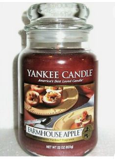 a yankee candle is sitting on a table