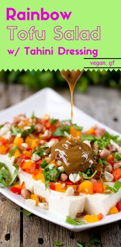 a plate with food on it and the words rainbow tofu salad w / tahiti dressing