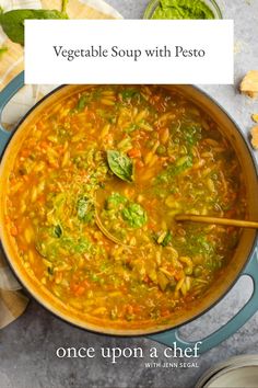 vegetable soup with pesto in a blue pot