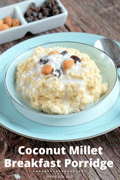 a bowl of oatmeal with nuts and raisins in it on a blue plate