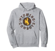 PRICES MAY VARY. Fan favorite Wyoming Cowboys apparel that is a great addition to any Wyoming fans wardrobe, making it a perfect gift for Christmas or graduation This Wyoming Apparel has a high quality digitally printed graphic perfect for any Cowboys fan that loves the classic design. Each shirt is officially licensed by University of Wyoming 8.5 oz, Classic fit, Twill-taped neck Cowboys Apparel, University Of Wyoming, Cowboys Hoodie, Wyoming Cowboys, Cowboy Outfits, Gift For Christmas, Wyoming, Graphic Prints, Classic Design