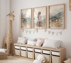 a room filled with furniture and pictures on the wall next to a stuffed giraffe