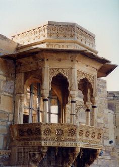 an old building with ornate balcony and balconies