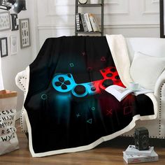 a blanket that has a video game controller on it