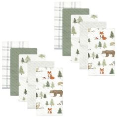 four napkins with animals and trees on them