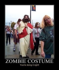 two people dressed as zombies walking down the street with caption that reads, zombie costume you're doing it right