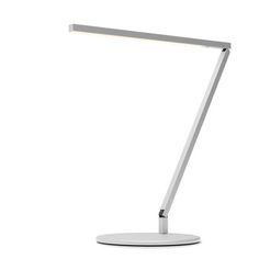 a white desk lamp with a dim light on the top and bottom part of it