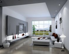 a modern living room with white furniture and large windows