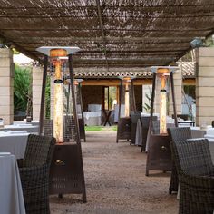 an outdoor dining area with tables and chairs