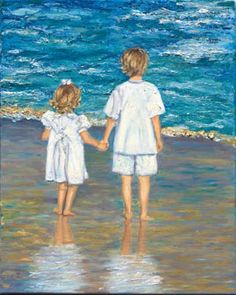 two children are holding hands on the beach