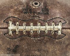 an old leather football is shown in this image