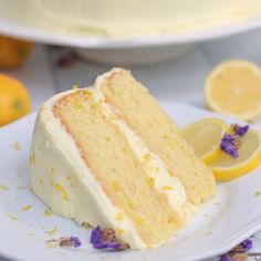 a slice of cake on a plate with lemons