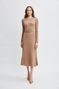 Immerse yourself in the essence of refined luxury with our soft touch Rib Cashmere Knit Dress. This long sleeve midi dress features an easy A-line silhouette & self-belt that is adorned with a gold buckle. Ultra-Soft & understated, this dress defines quiet luxury and can be worn with pumps or the seasons knee grazing boots. Long Sleeve Cashmere Midi Dress with Self Belt & gold buckle 100% Cashmere Runs true to size Model is 5'9" and wearing size S Dry Clean Only Imported Style #: ETR44242 Belt Gold Buckle, Boots Long, Cashmere Sweater Dress, Belt Gold, Long Sleeve Short Dress, Quiet Luxury, Long Sleeve Midi, Knit Tees, Long Sleeve Midi Dress