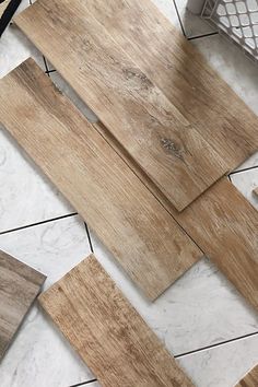 several different types of wood flooring laying on the ground