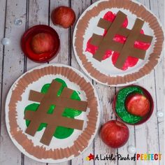 two paper plates that have apples on them and one is made to look like an apple pie