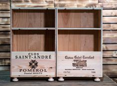 two wooden boxes with wine labels on them