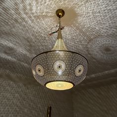 a chandelier hanging from the ceiling in a room