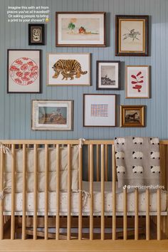 a baby's crib with pictures on the wall