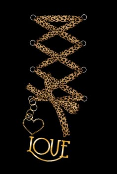 the word louf written in gold on a black background with an animal print pattern