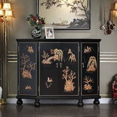 This black entryway cabinet, adorned with intricate hand-painted relief artistry, brings an added touch of dynamic elegance to any space. The well-crafted lines are both beautiful and fluid, enriching the cabinet with a distinct vintage charm. DineElegance. r | DineElegance.r Entrance cabinet side cabinet decorative cabinet / brown / gray / yellowWood in Black | 37" H X 47.24" W X 14.17" D | Wayfair Black Entryway, Asian Cabinet, Entrance Cabinet, Freestanding Storage Cabinet, Entryway Cabinet, Freestanding Storage, Decorative Cabinet, Asian Homes, Cabinet Black