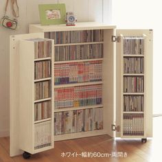 an entertainment center with several dvd's in it