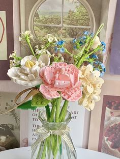 a vase filled with flowers on top of a table