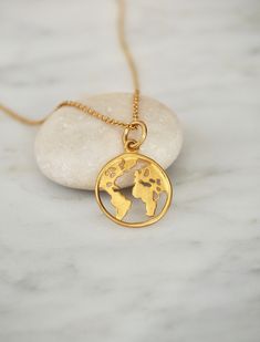 "Dainty Gold Globe Charm Necklace, Earth Necklace, Boho Jewelry, Globe Pendant, Globe Choker, World Map Necklace, Travel Gift, Symbolic Necklace, Gift for Her This Globe Necklace is made with a 14k Gold Filled Chain and a Gold Plated Sterling Silver Map Charm. A must-have for anyone who loves this beautiful world of ours. Keep our planet close to your heart with this necklace - a globe world map pendant on a stunning dainty chain. The length of the necklace can be chosen by you; the available le Earth Necklace, Globe Necklace, World Map Necklace, Gold Globe, Map Pendant, Symbol Necklace, Map Necklace, Dainty Chain, Globe Pendant