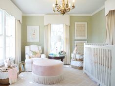 a baby's room is decorated in neutrals and pastel colors with chandeliers above the crib