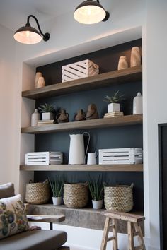 a living room filled with lots of shelves