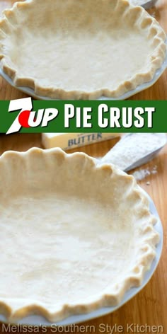 two pie crusts sitting on top of a wooden table