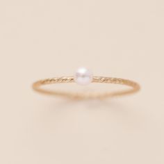 This is a great texture piece.  It makes any stack more versatile and beautiful, and features the cutest pink pearl. This dainty look will be great with the a stack or by itself. Details: Location: Finger (order larger or smaller sizes depending on which finger you choose to wear it) Thickness: 3mm Sizes: 5,6,7,8 Style: Minimalist/Dainty Made with: 14K Gold Filled Why Gold Filled? Gold filled is a layer of 14K gold that has been pressure bonded to a brass base metal. Gold filled has 100 times more gold than gold plating and is much more valuable and tarnish resistant. It will not flake, rub off, or turn color. It can be worn without worries of an allergic reaction to the jewelry. Rings Minimalist, Dainty Rings, Sparkling Rings, Twist Ring, Minimalist Ring, Rings For Girls, Western Jewelry, Pink Pearl, Minimalist Rings