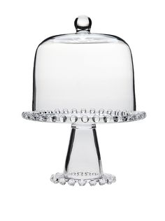 a glass cake stand with a dome on top