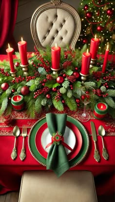 a christmas table setting with red and green decorations