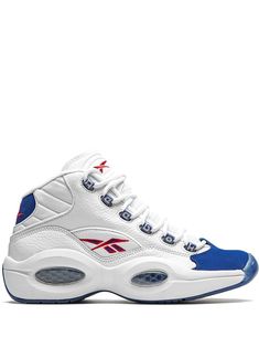 White/royal blue/red leather/rubber Question Mid sneakers from REEBOK featuring round toe, ridged rubber sole, front lace-up fastening and branded insole. These styles are supplied by a premium sneaker marketplace. Stocking only the most sought-after footwear, they source and curate some of the most hard to find sneakers from around the world. | Reebok Question Mid sneakers Reebok Question Mid, Reebok Question, Red Reebok, Blue Toes, Mid Sneakers, White Reebok, Kicks Shoes, Round Toe Sneakers, Reebok Sneakers