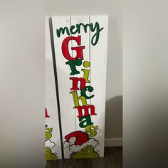 a wooden sign with the words merry grin on it