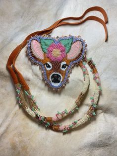 the beaded purse has a deer head on it