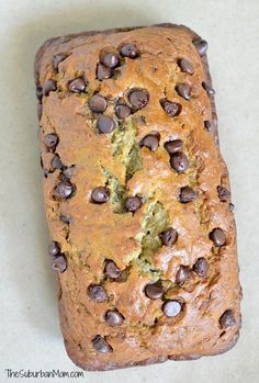 a loaf of chocolate chip zucchini bread on top of a white countertop