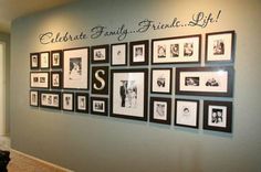 a family tree with pictures on it and the letter s hanging in front of it