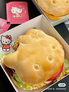 hello kitty sandwich in a box with the lid open and ready to be eaten by someone