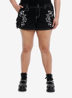 Jack Skellington is here to make sure you're rocking that Halloween Town style into summer! These black shorts feature printed designs on the front of Jack's face  bats and filigree. Comes with hip  back and cargo pockets. Complete with an elasticated waistband with snap-button and zipper closures.100% cottonWash cold; dry lowImportedModel is 5'10''Model wears size 1 Halloween Streetwear Short Bottoms, Punk Style Short Bottoms For Festival, Halloween Emo Cotton Bottoms, Halloween Emo Style Cotton Bottoms, Emo Cotton Bottoms For Halloween, Black Shorts For Halloween Streetwear, Punk Style Shorts For Festivals, Gothic Summer Shorts For Streetwear, Alternative Style Cotton Shorts For Alternative Fashion