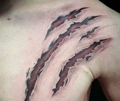 the back of a man's upper half with red and black ink